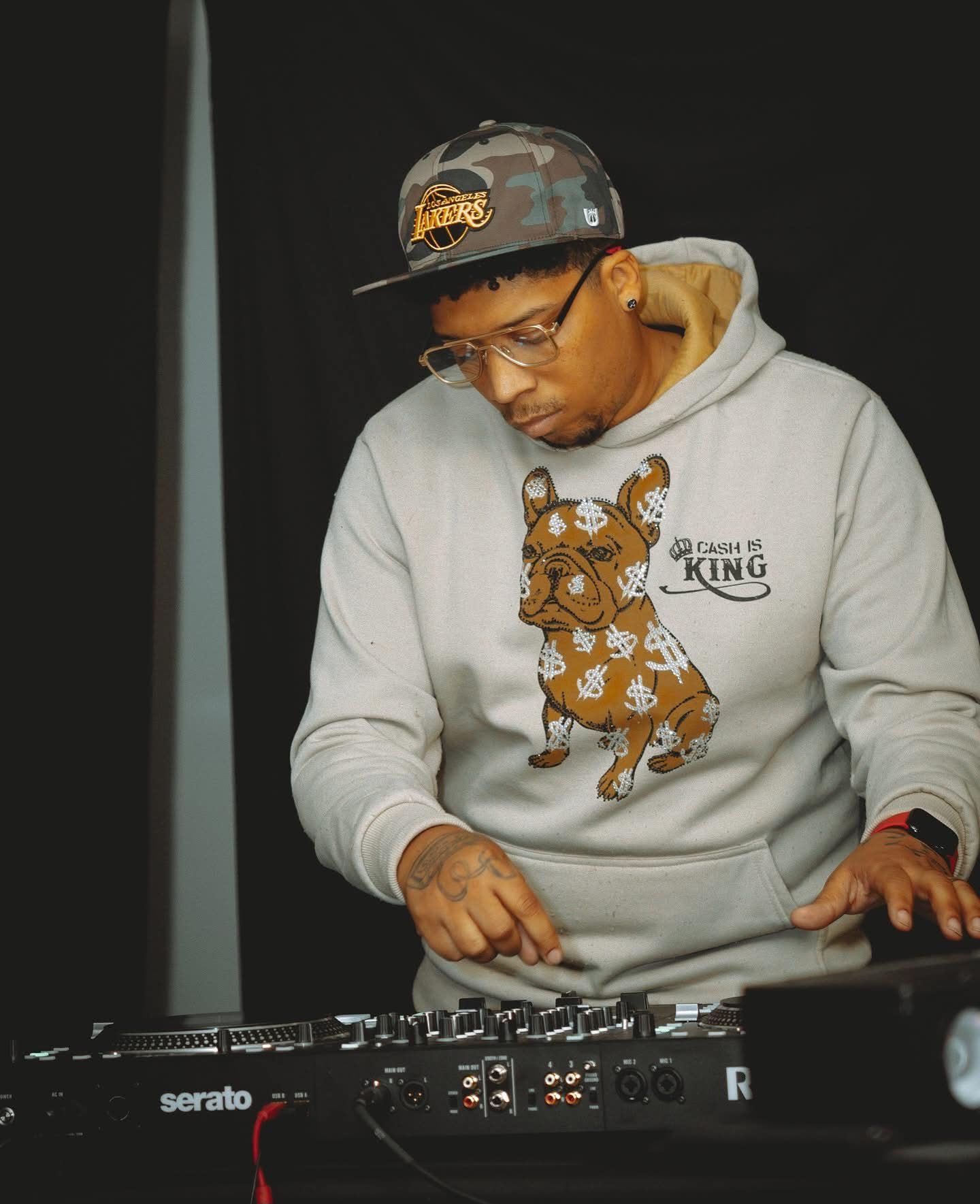 DJ Endy on Serato decks in Cash Is King hoodie